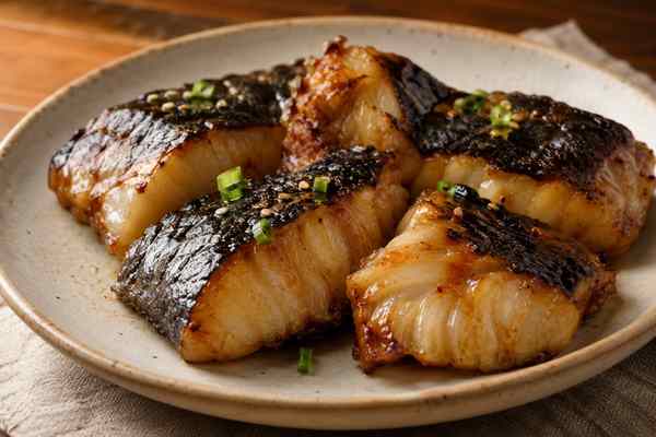 Finished Doenjang-Glazed Grilled Black Cod presented in a warm Korean dining setting.