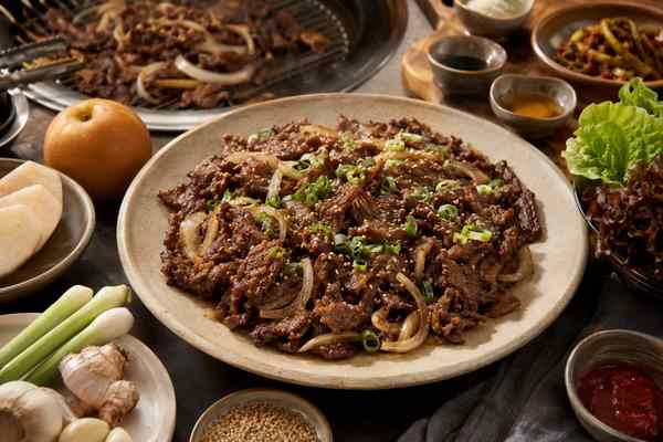 Finished Classic Korean Pear Beef Bulgogi presented in a warm Korean dining setting.